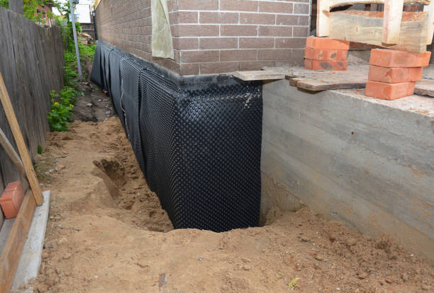 SJ Waterproofing Pros technician performing targeted Waterproofing assessment in Lizton, IN